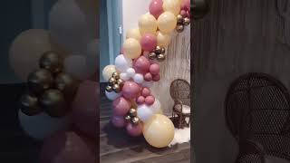 Vibrant boho rainbow decor for a one-year celebration #balloongarland