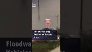 Floodwaters Trap Vehicles on Toronto Street