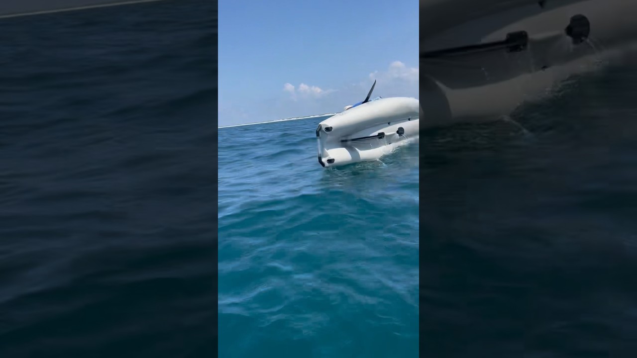 Guy flips kayak while holding a sailfish.