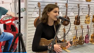 Lovely girl ukulele playing and singing