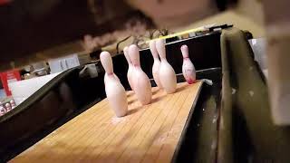 Mini bowling strike in slow motion.