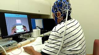 A patient using the EsoGlove device to move a towel screenshot 4