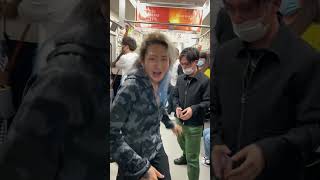 Japanese crazy man singing in a train