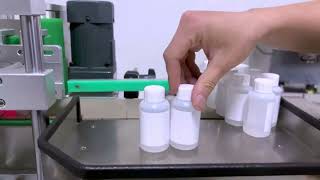 Chuck bottles filling capping and labeling machine automatic tabletop type filler line