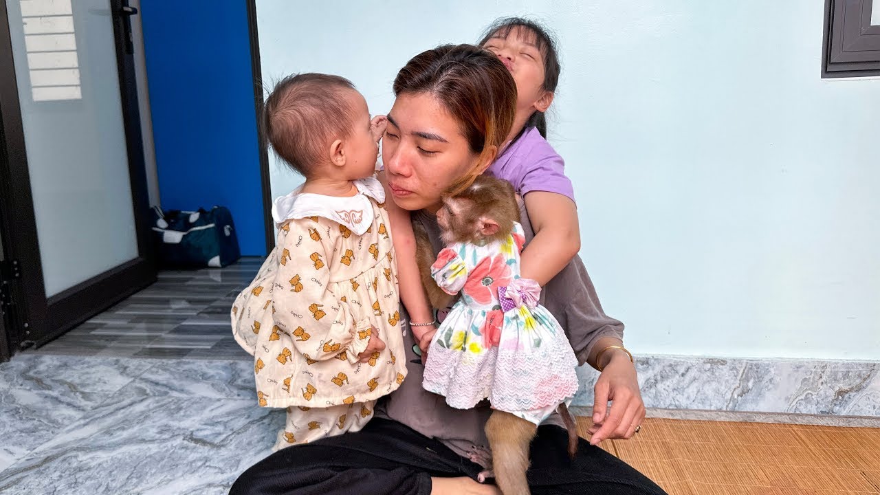 Quynh, Diem, and Monkey hugged mom tightly when mom came home.