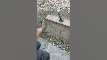 Haunching concrete using a gauging trowel, setting in 80mm block pavers 🔥#shorts