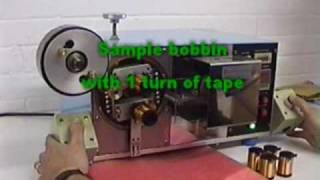 TP-01 machine applies insulation tape to wound coils.