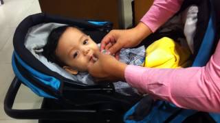 Clay playing with his pacifier