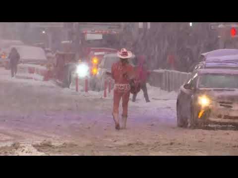 Naked Cowboy performs in Times Square blizzard