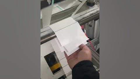 Mechanical arm pick up sheet material continous die cut