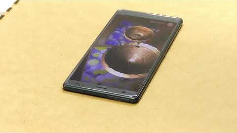 ARcheoBox: Engaging with Historical Artefacts Through Augmented Reality and Tangible Interactions