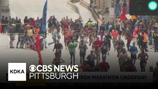 Runners cross the finish line at the 2026 Pittsburgh Marathon