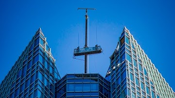 US window washers rescued after platform swings out of control