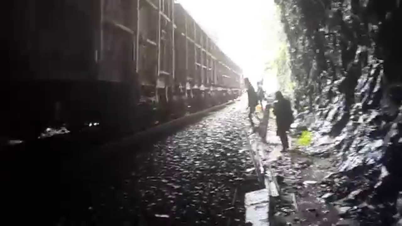 Flattening a coin on railway track under a tunnel at Dudhsagar YouTube