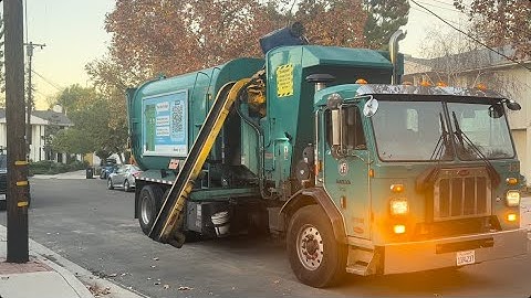 A Peterbilt 520 LNG Amrep finishing up late recycling route