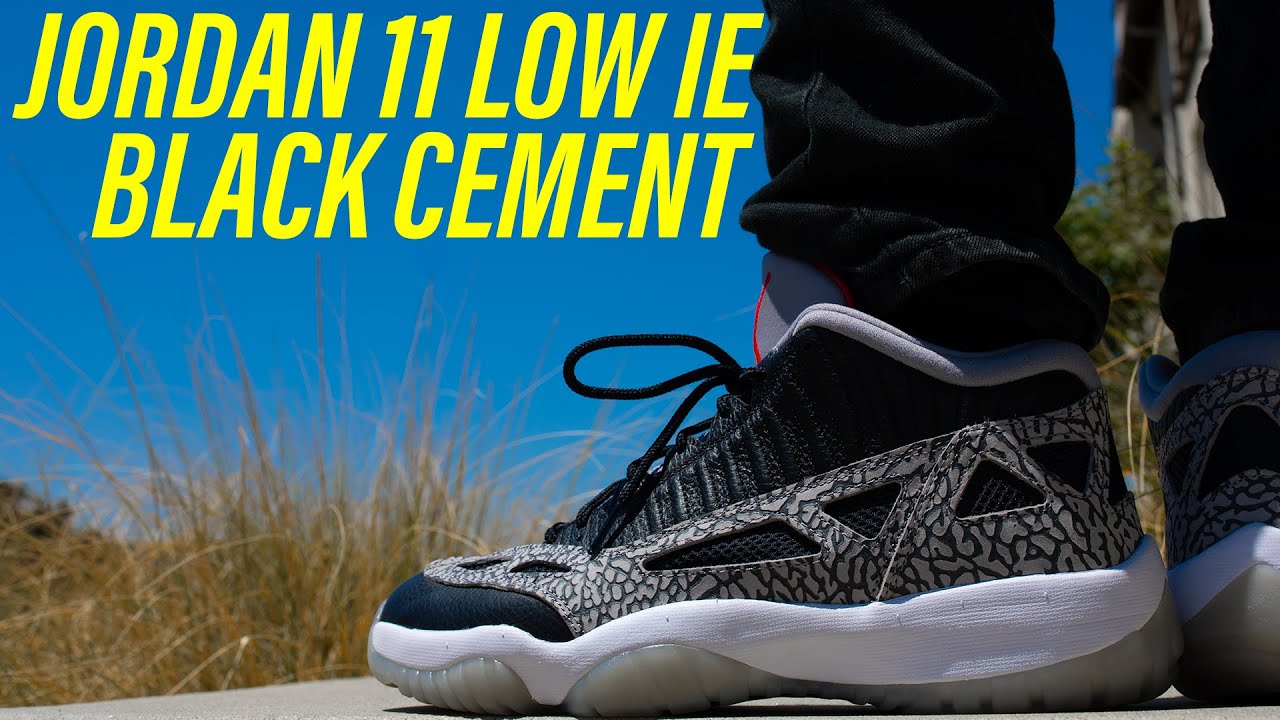 jordan 11 low ie black cement on feet