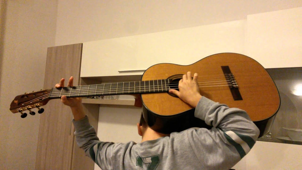 Bambino prodigio suona chitarra dietro la schiena YouTube