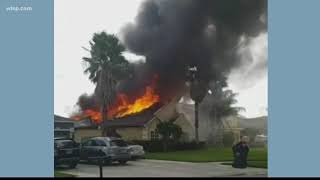 Tampa firefighter saves neighbor from burning home