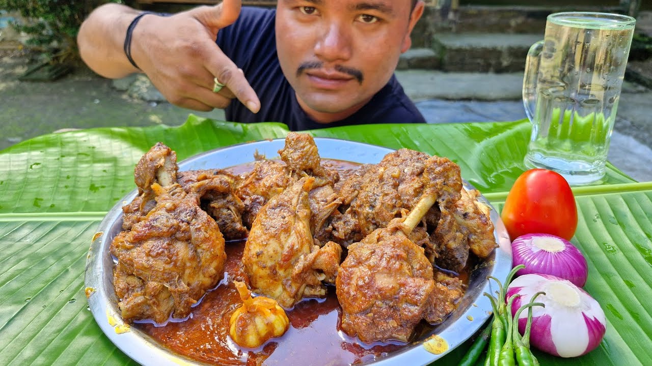 EATING CHICKEN LEG PIECE GRAVY WITH ONION GREEN CHILLI 