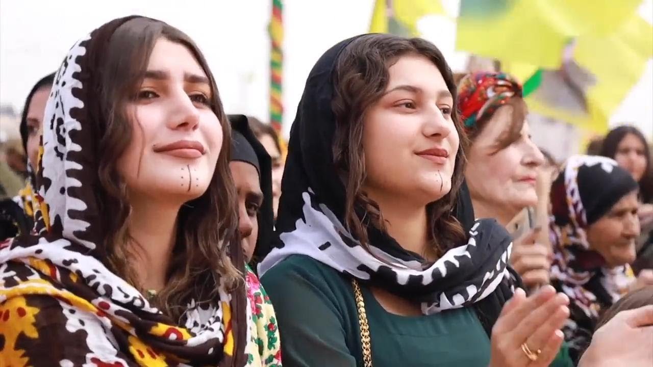 Hundreds of Syrian Kurds celebrate Newroz with bright costumes, dancing
