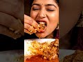 Woman eating spicy mutton curry