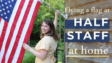 How to fly a flag at half staff on a house using a mourning ribbon