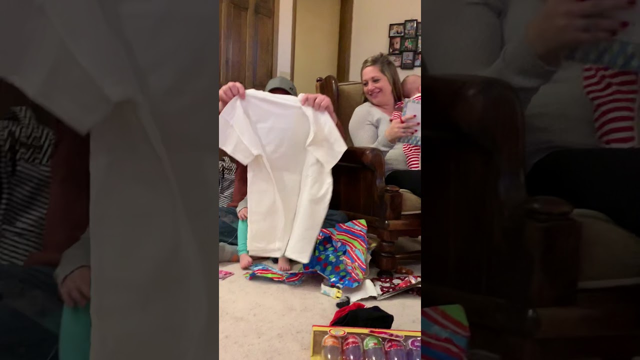 December 2019 iPhone 9 - Kevin opening shirt with pic of Ashley