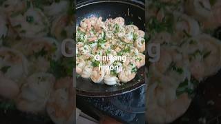 shrimps with parsley leaves and olive oil.