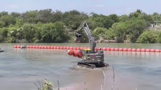Biden administration sues Texas governor over Rio Grande buoy barrier that’s meant to stop migrants