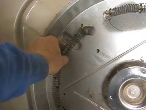 How do you replace the heating element in a GE dryer?