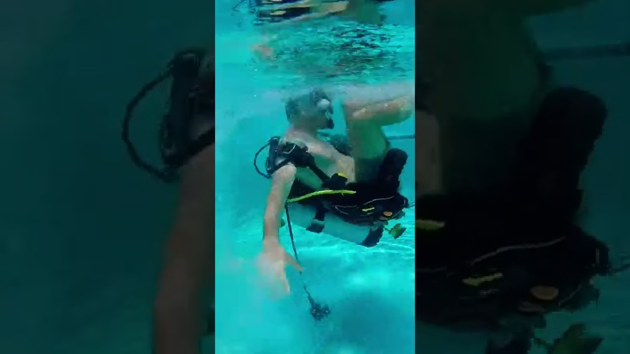 Scuba training in the pool: how to put BCD back on. #sailingbyefelicia