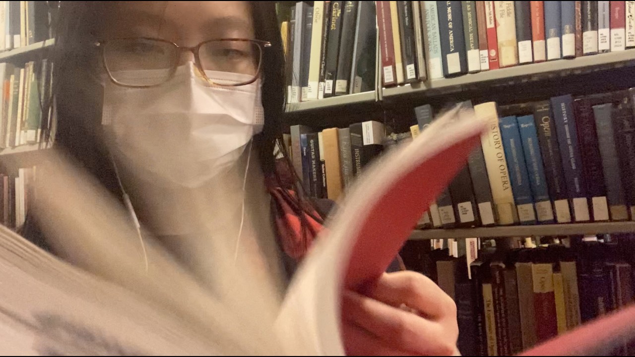 asmr with books and an apple mic