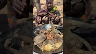 Primitive cooking: Preparing baboon meat with no modern tools