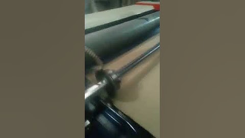 Corrugated sheet cutting machine with slitter attachment
