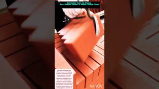 Efficient Way to Stack Red Bricks Using a Brick Tongs Tool