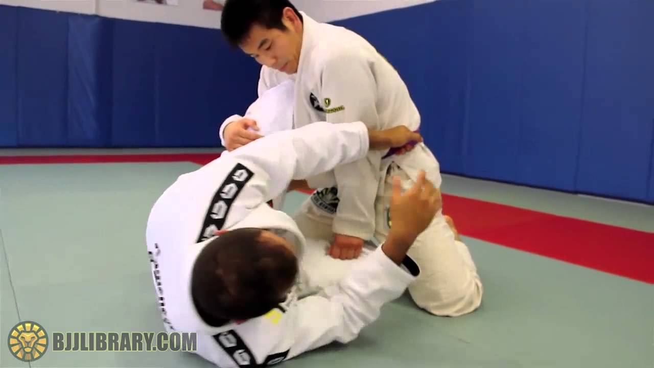 Yuri Simoes Belt Grip Backroll Sweep from Half Guard BJJ LIBRARY