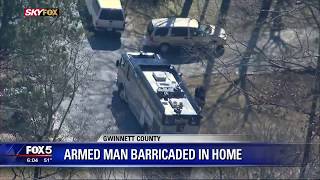Gwinnett County armed man barricaded in home