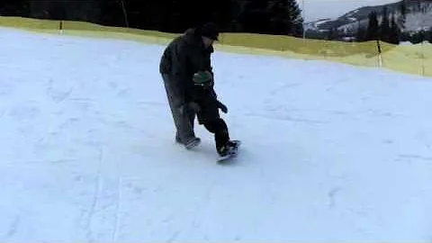 Maximus snowboarding at age two and a half