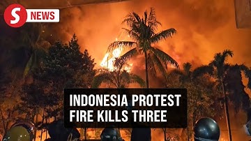Three dead as Indonesian protesters set fire to regional parliament building