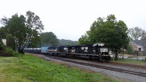 NS 66E SB in the rain with DME SD40-2 trailing