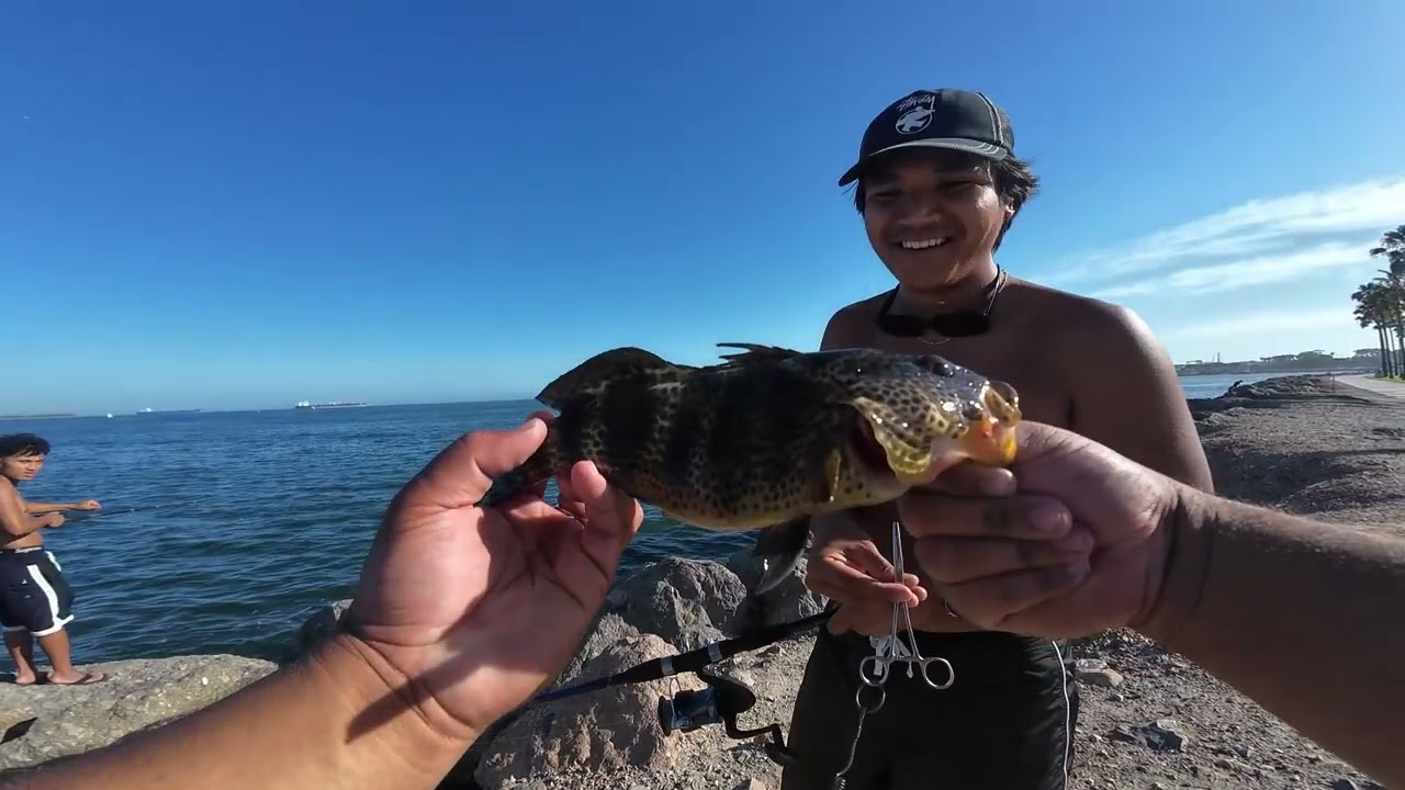 Long Beach Bass fishing. My Cousin hooked up to his first Spotty!