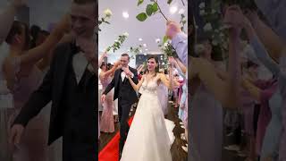 Pure Wedding Joy Bride & Groom Dance Under A Shower Of Flowers