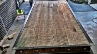 This is a firehouse table I built. The table is build from 8" steel I-beams, 6" steel channel and 1.25" thick solid oak. It has a vinyl black 