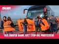 Bus driver rams just stop oil protesters blockade nearly running them over