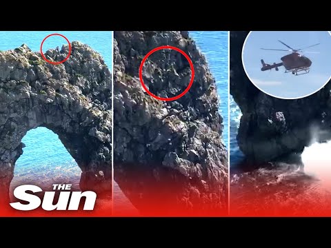 Terrifying moment idiot thrill-seeker plunges 200ft from Durdle Door.