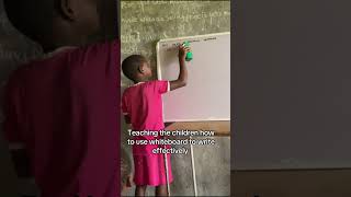 Teaching The Children How To Use Whiteboard To Write Effectively 