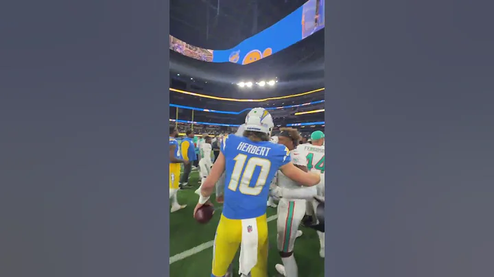 Herbert And Tua Hug After Bolts Win