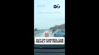 Out-of-control car nearly hits trooper