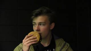 Logan Finally eats a hamburger