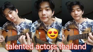 handsome guy playing guitar Lee Thanat Lowkhunsombat